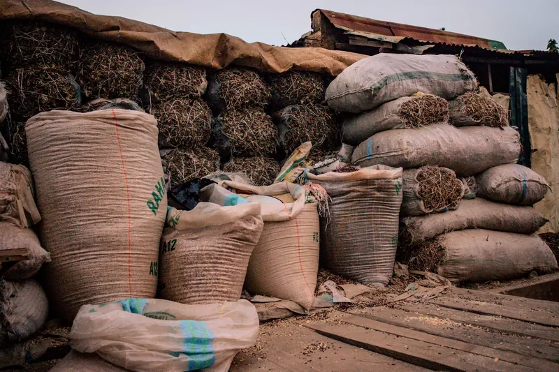 Sacks of produce stacked in a warehouse
